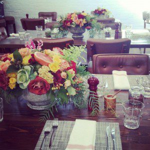 fruit and flowers, oranges, celosia, roses, cabbage, centerpiece, restaurant design, event flowers