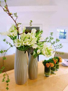 Home floral: bittersweet vine, white calla lilies, valencia roses, trachelium centerpiece