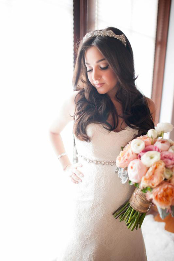 Celebrity Alisan Porter in her wedding dress holding a bridal bouquet by La Petite Gardenia.