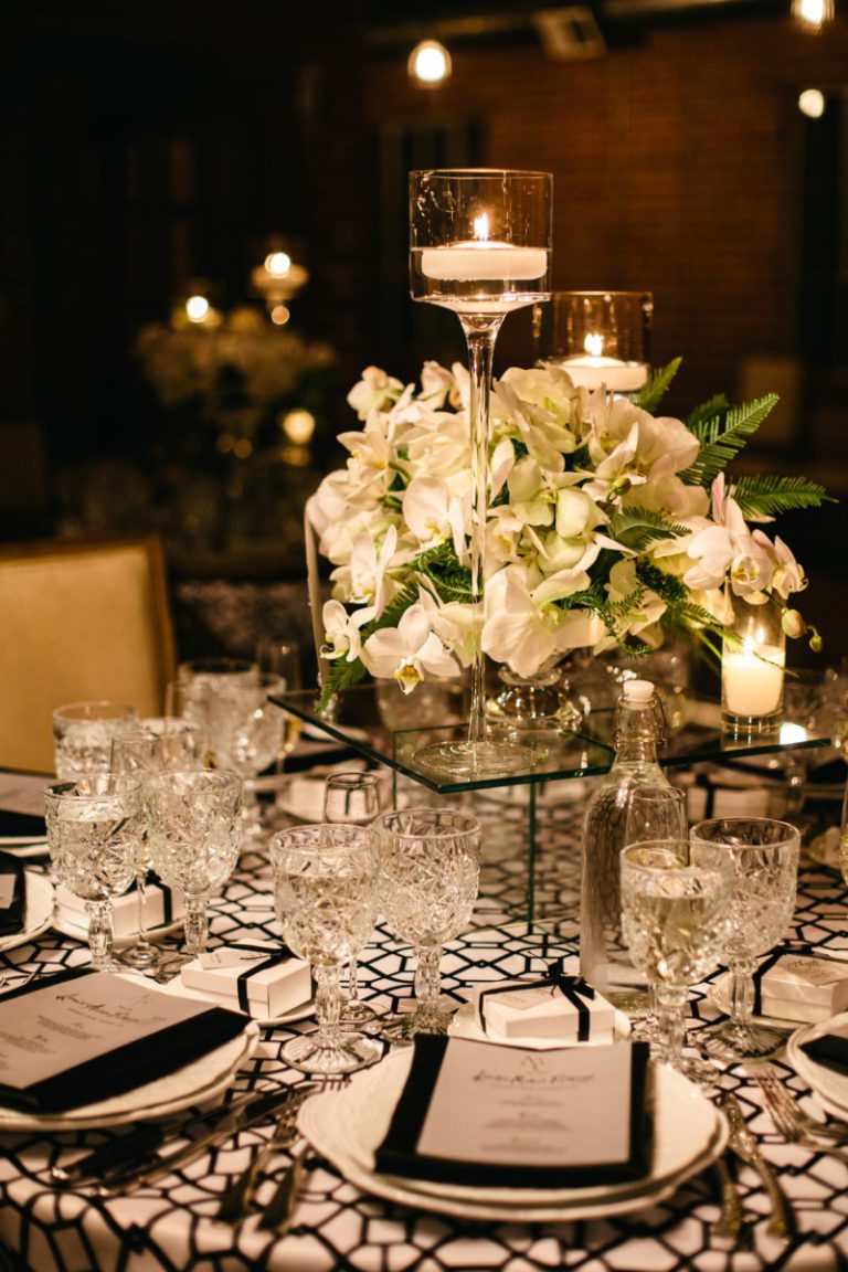 Close up of wedding table set up and centerpiece with white flowers at Carondelet House.